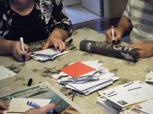 Volunteers re-addressing Christmas cards