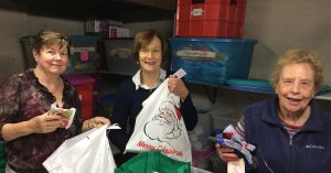 volunteers packing gift parcels